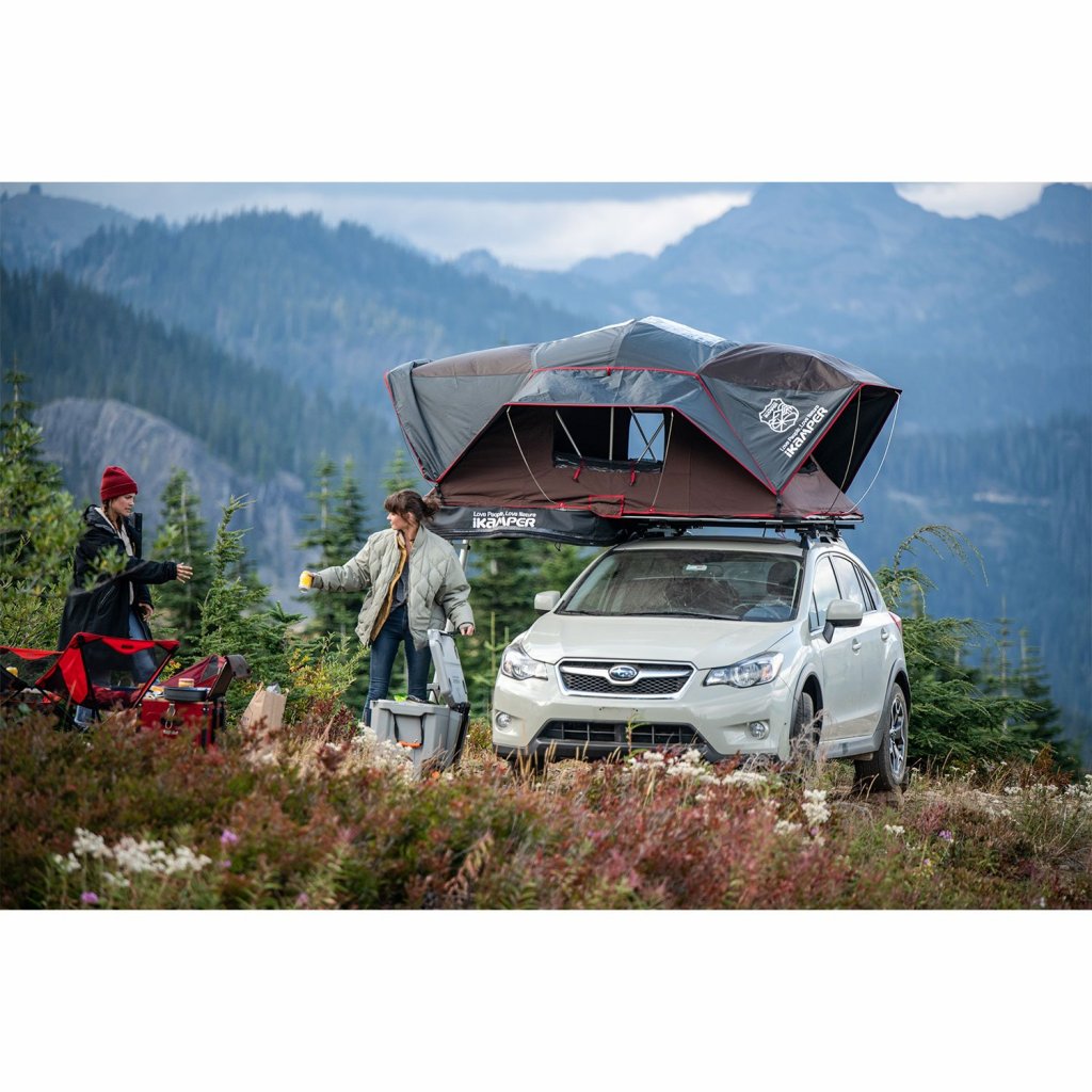 A car with a roof top tent in the New Zealand wilderness
